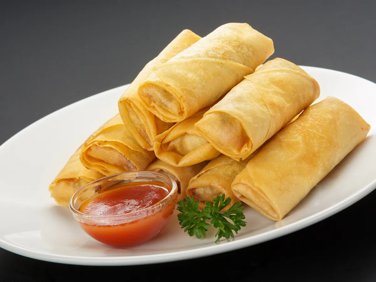 Crispy fried spring rolls served with sweet chili dipping sauce